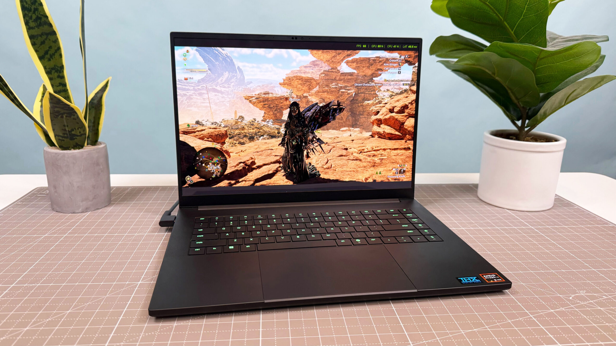 Monster Hunter Wilds gameplay on the Razer Blade 16 (2025) with an Nvidia RTX 5090 Laptop GPU. The fps counter in the upper right-hand corner shows frame rates with DLSS off.